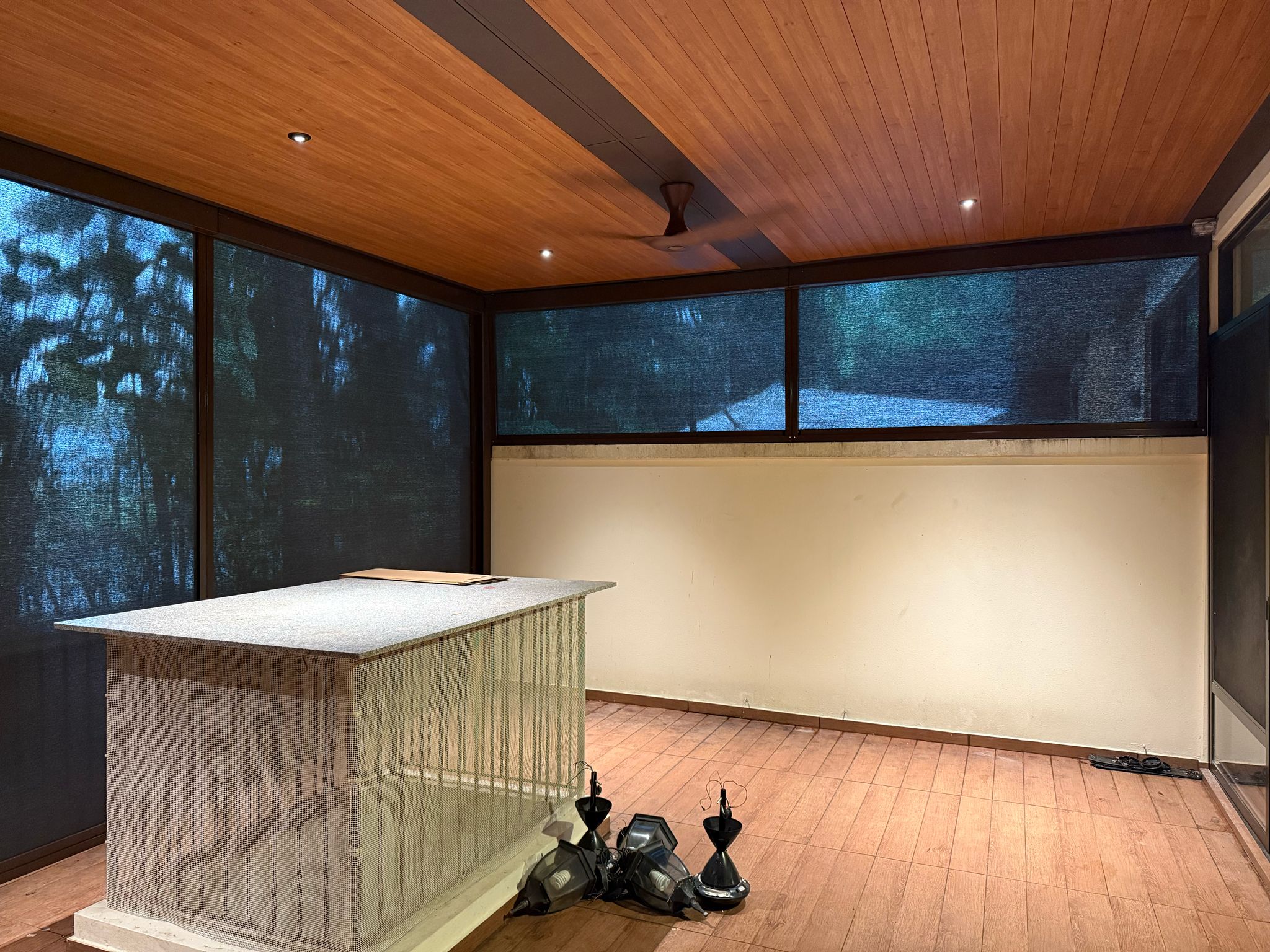 Completed outdoor zip blinds enclosing a patio dining area